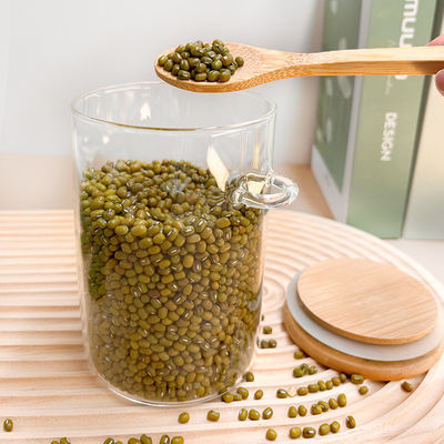 ظروف ذخیره سازی مواد غذایی شیشه ای شفاف با طراحی کاربردی و کاور چوبی گرد